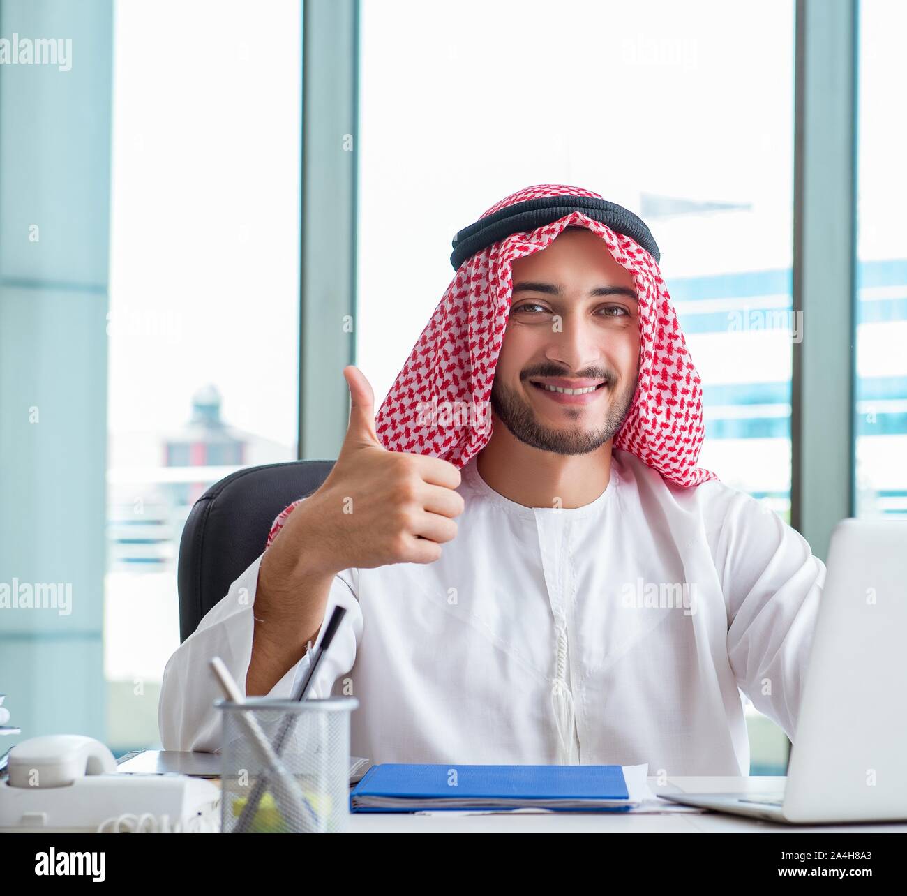 Arab businessman working in the office Stock Photo - Alamy