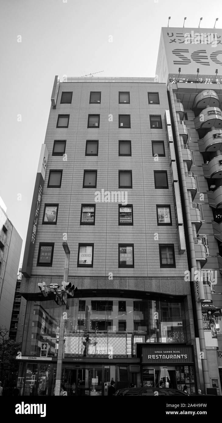 shopping mall ginza district narrow tall building restaurant black white Stock Photo
