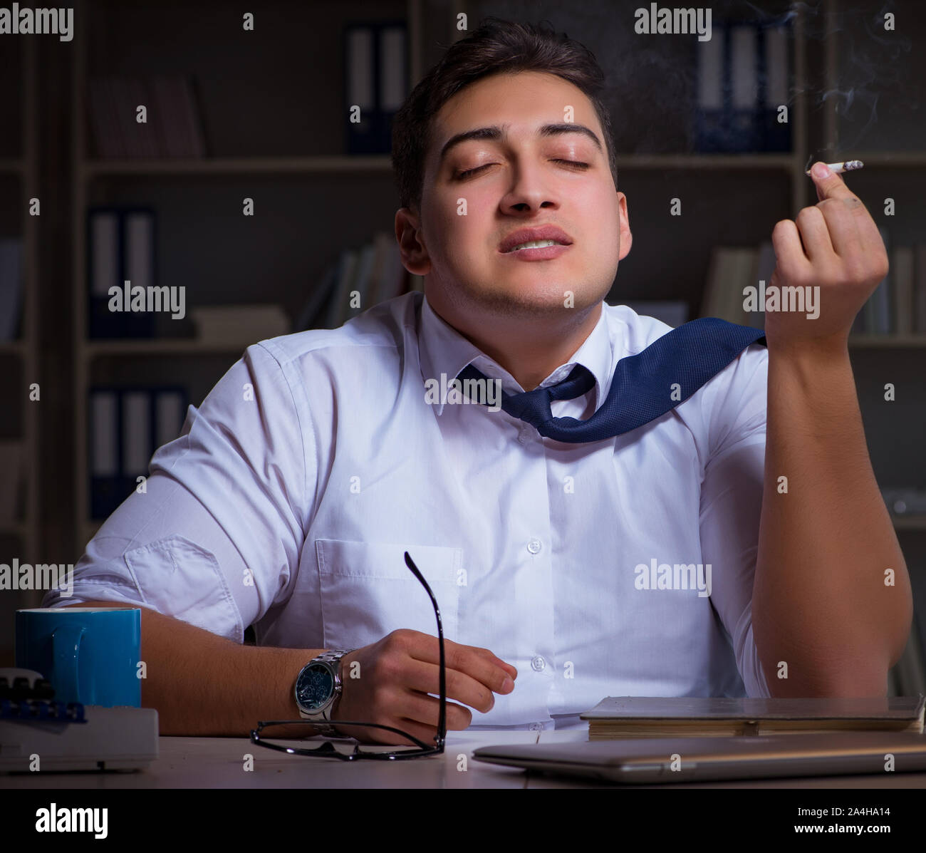 The man staying late at night and smoking marijuana Stock Photo - Alamy