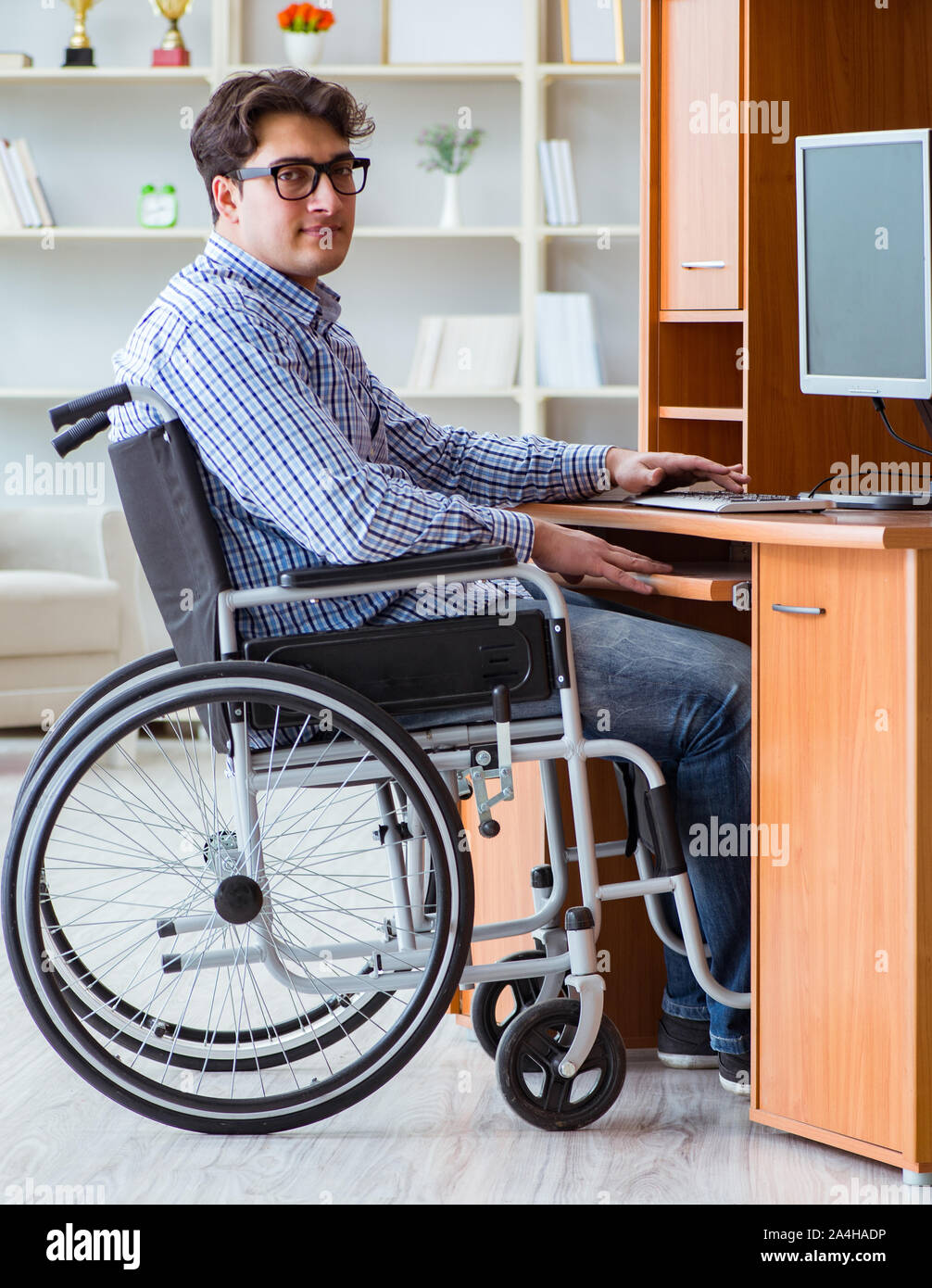 The disabled student studying at home on wheelchair Stock Photo - Alamy