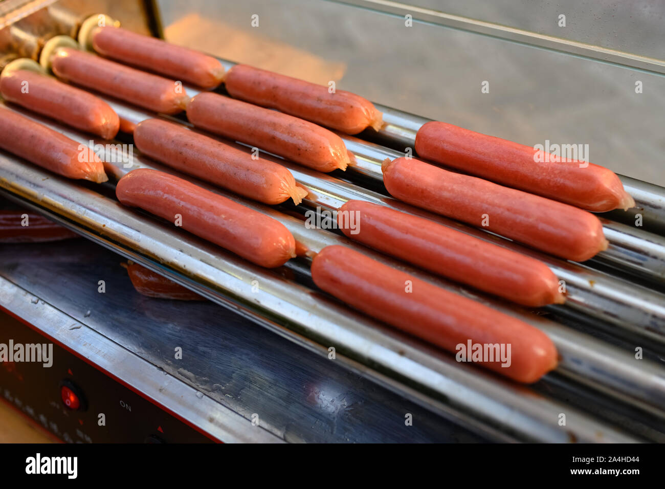 grilled roast sausages on bbq machine Stock Photo Alamy
