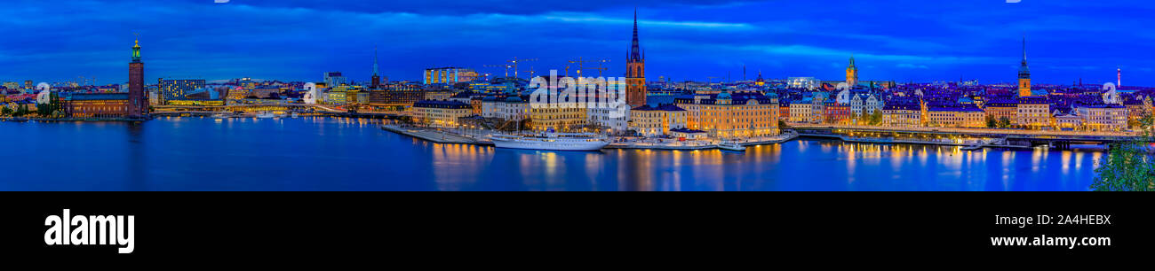 Stockholm, Sweden - October 24, 2017: Sunset panorama of Lake Malaren, City Hall Stadshuset in Kungsholmen, gothic buildings in old town Gamla Stan Stock Photo