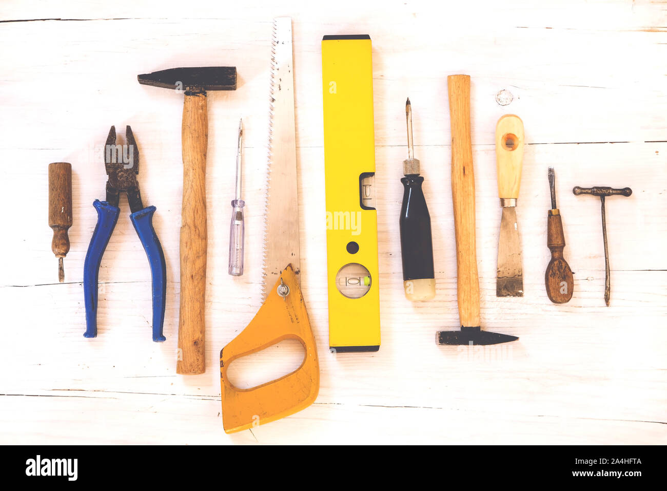 Tools collection on white wooden background Stock Photo