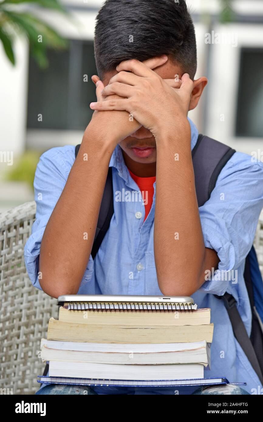 An Unhappy Male Student Stock Photo - Alamy