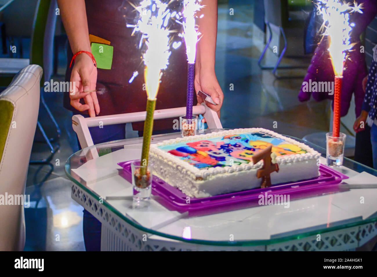 Birthday cake with bright candles. Kid party Stock Photo Alamy