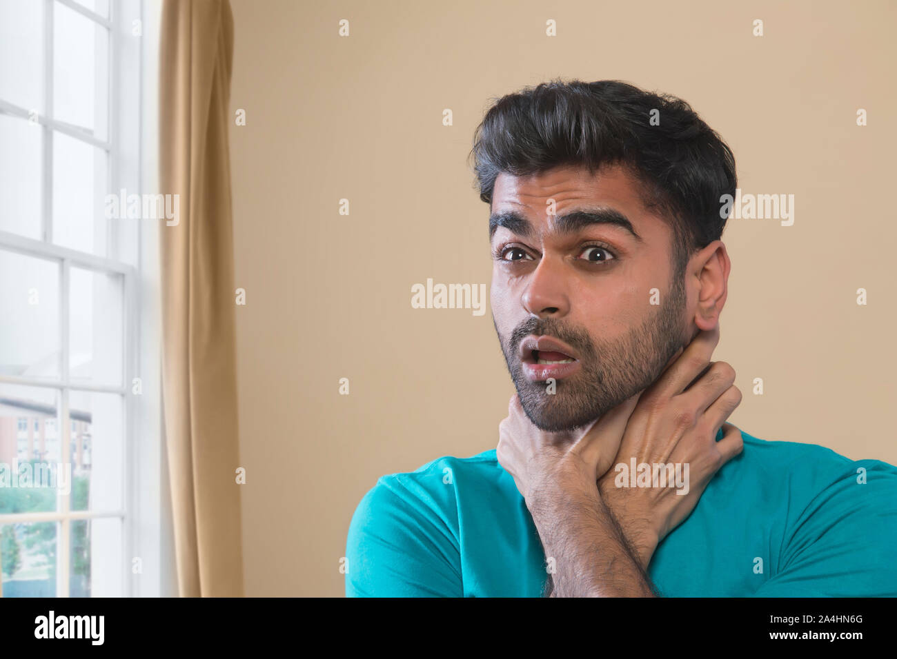 man suffocating from anxiety attack Stock Photo