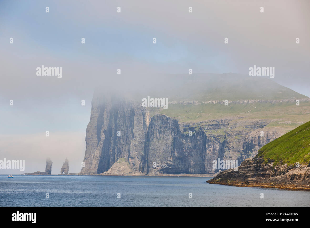 Faroe islands coastline cliffs landscape. Rising og kelling stacks. Eysturoy Stock Photo