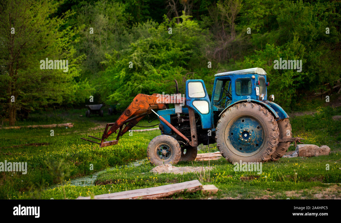 Old tractor on the field Stock Photo - Alamy