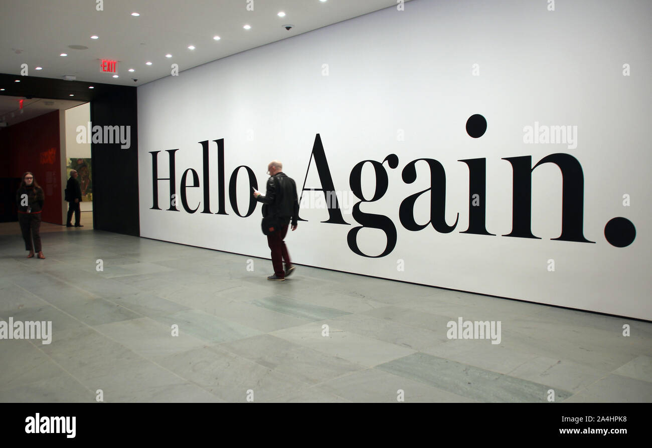 Hand Lettering Hello Again New York, USA. 11th Oct, 2019. People pass by the black lettering ...