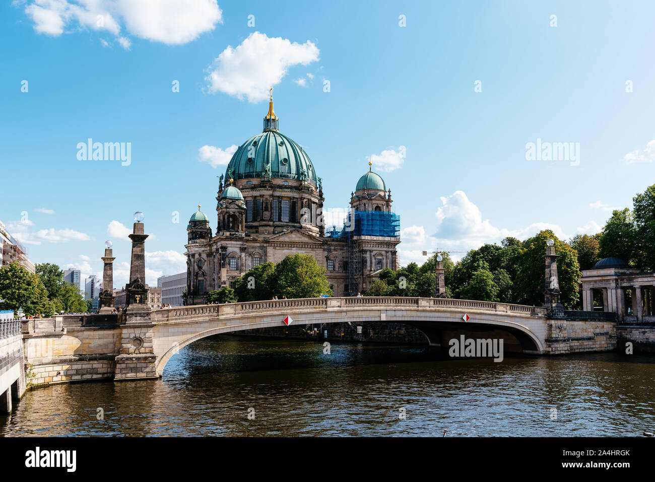 Berlin, Germany - July 27, 2019: Scenic view of Spree river, Friedrichs Bridge and Berlin Cathedral or Berliner Dom in Museum Island Stock Photo