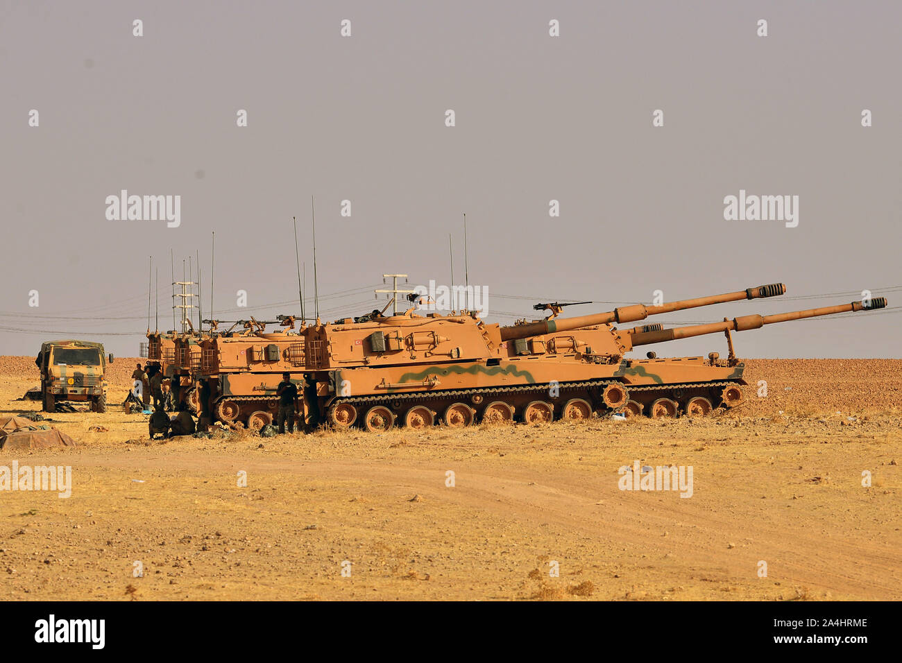 Ankara. 13th Oct, 2019. Photo taken on Oct. 13, 2019 from Turkey's Akcakale shows Turkish self-propelled artillery guns attacking Tal Abyad in northern Syria. Turkish Armed Forces have taken control of Tal Abyad and Ras Al-Ayn towns in northern Syria, Turkish Minister of Defense Hulusi Akar said on Monday. Credit: Mustafa Kaya/Xinhua/Alamy Live News Stock Photo