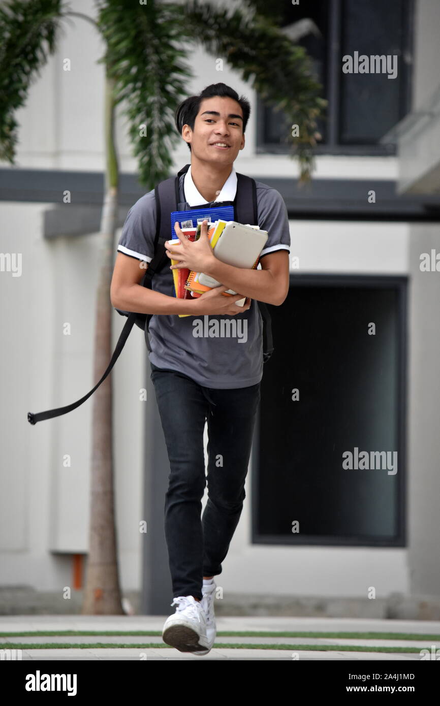Happy Youthful Student Walking On Campus Stock Photo - Alamy