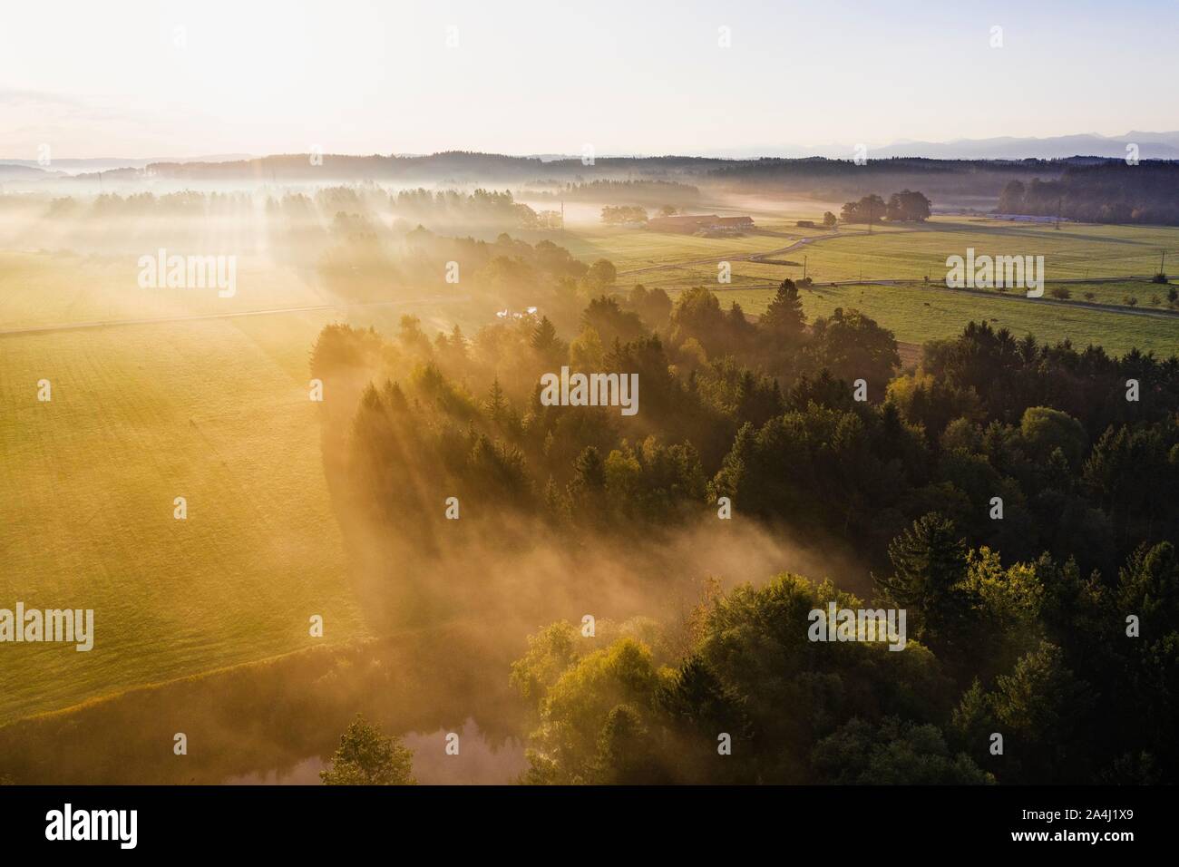 Cultural landscape with Loisach Canal in the morning fog, near Gelting near Geretsried, Tolzer Land, aerial view, Upper Bavaria, Bavaria, Germany Stock Photo