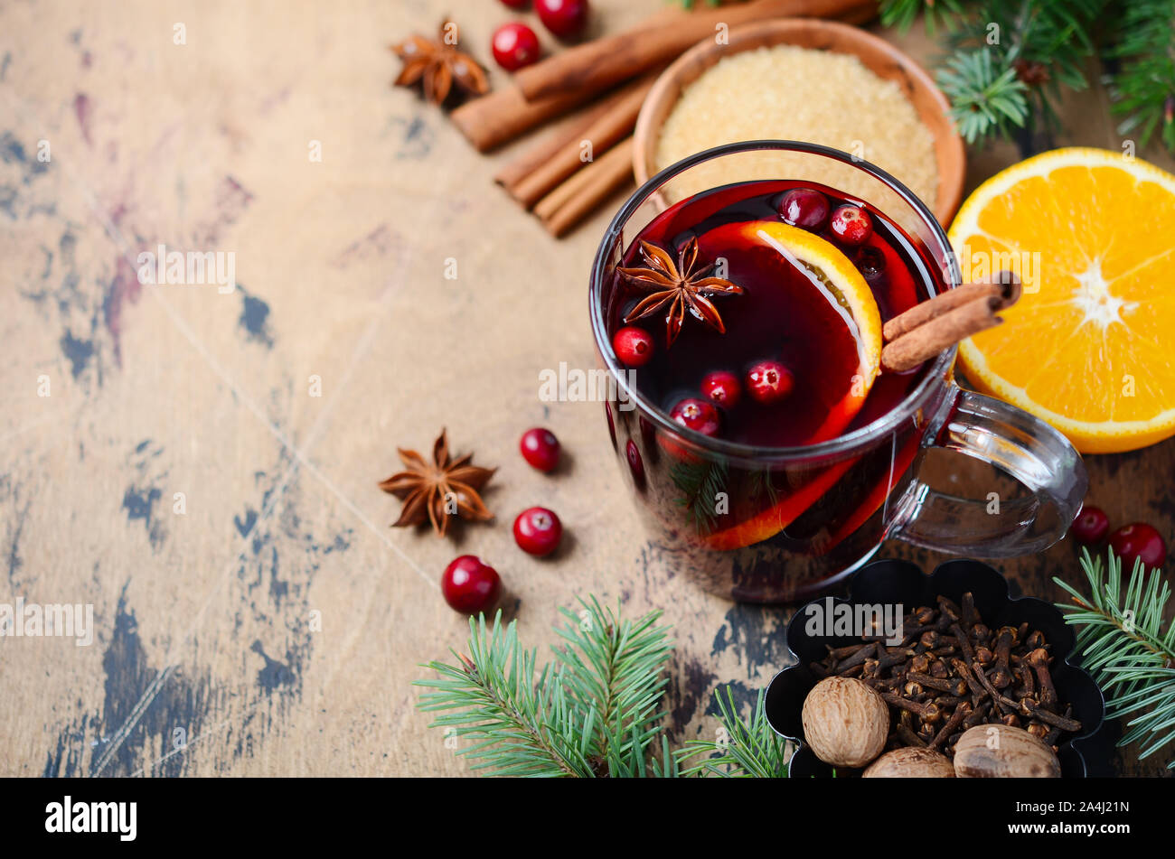 Christmas Mulled Red Wine with Orange, Cranberries and Spices. Holiday Concept. Stock Photo