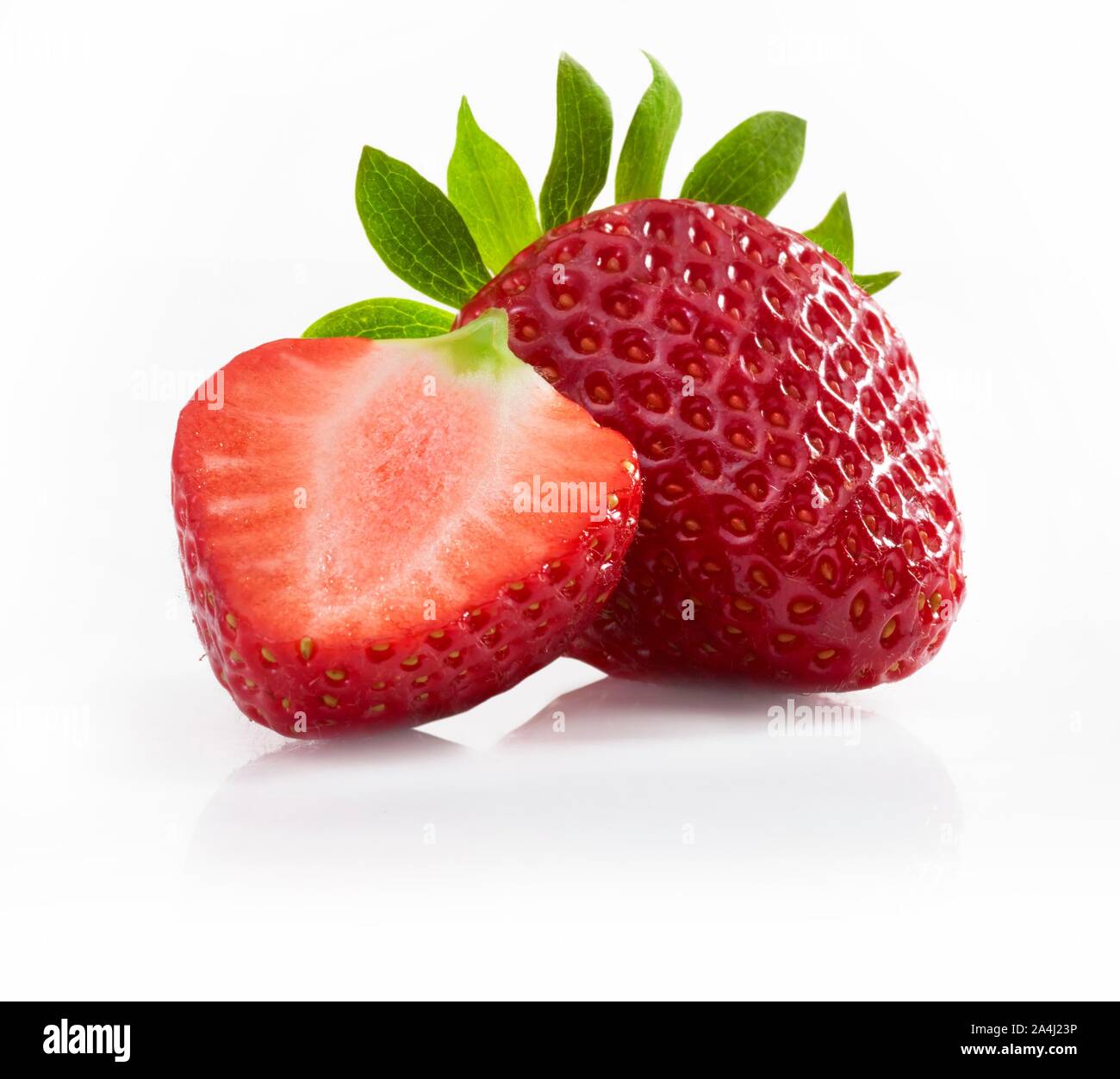 Strawberries (Fragaria), cut and whole fruit, cutout, studio shot, Germany Stock Photo