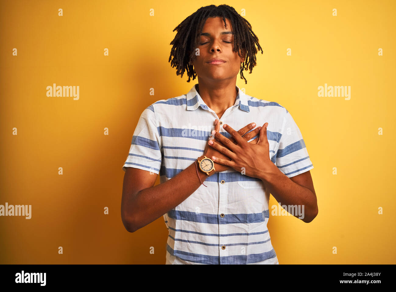 Dreadlocks Chest Afro american man with dreadlocks wearing striped shirt over isolated ...