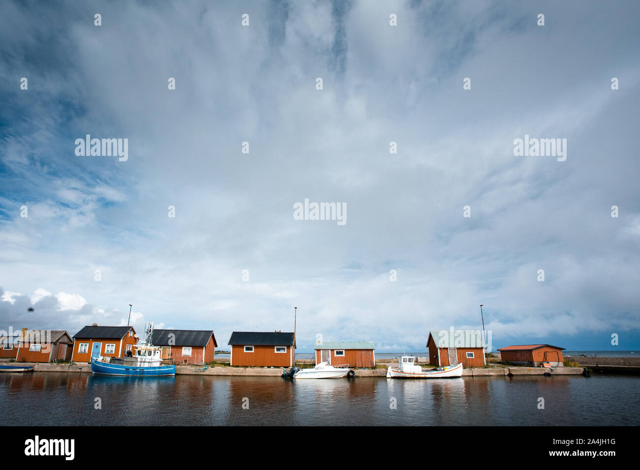 little harbour with blue an white fishing boats Stock Photo