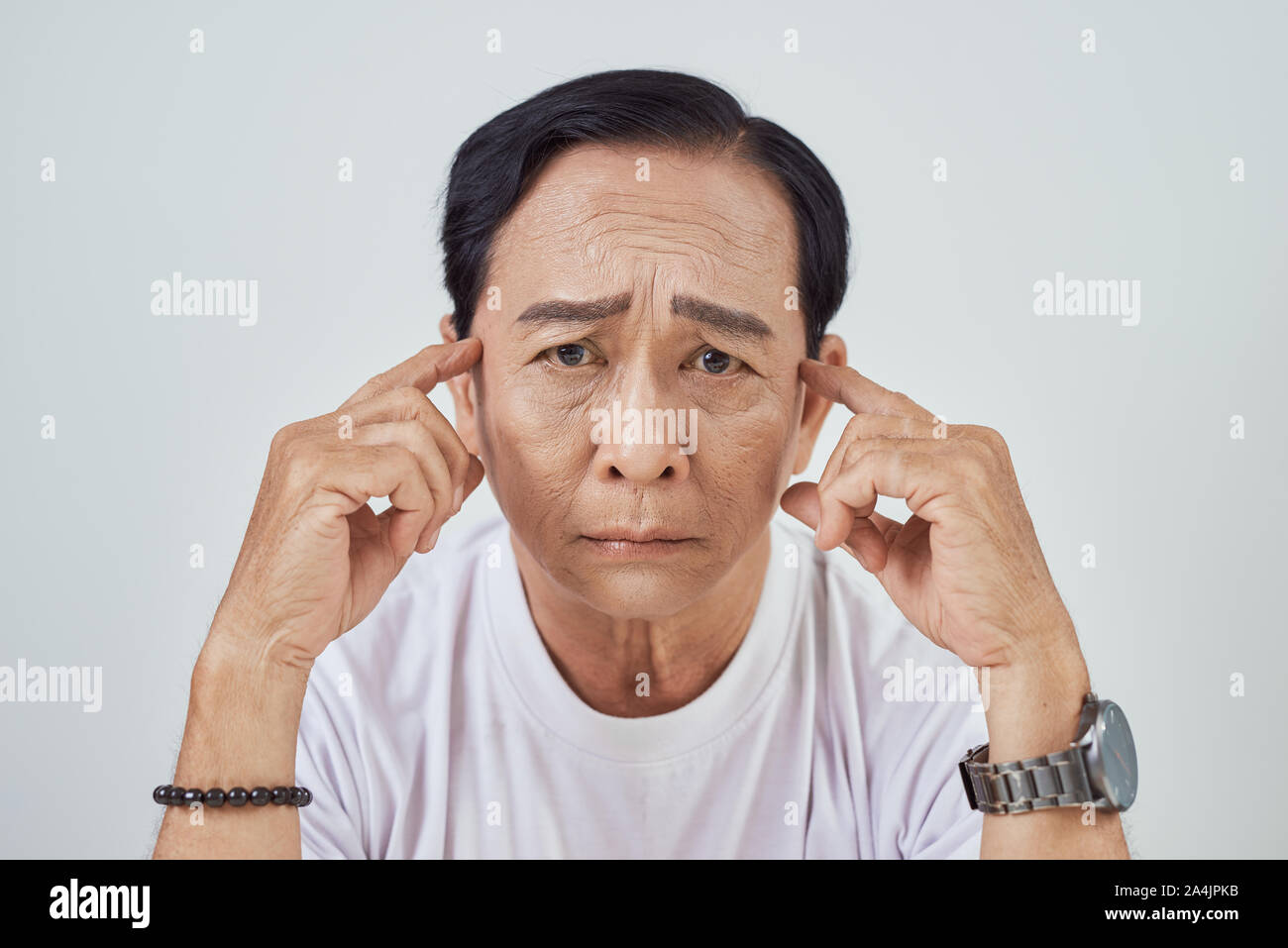 Asian elder suffer from stroke and powerful headache or brain attack Stock Photo