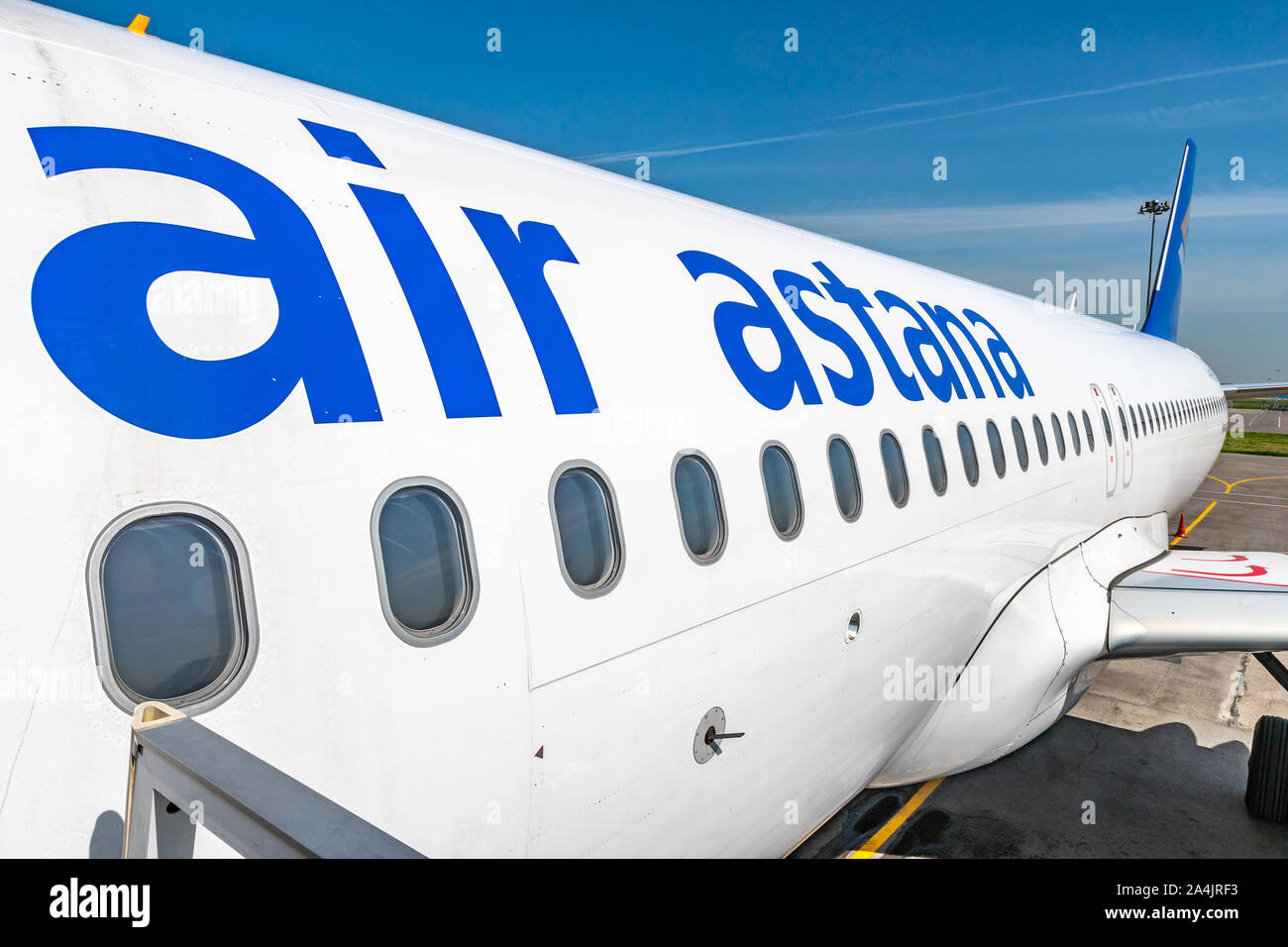 At Almaty International Airport Passengers are Waiting Outside for Boarding the Air Astana Aircraft Plane Stock Photo