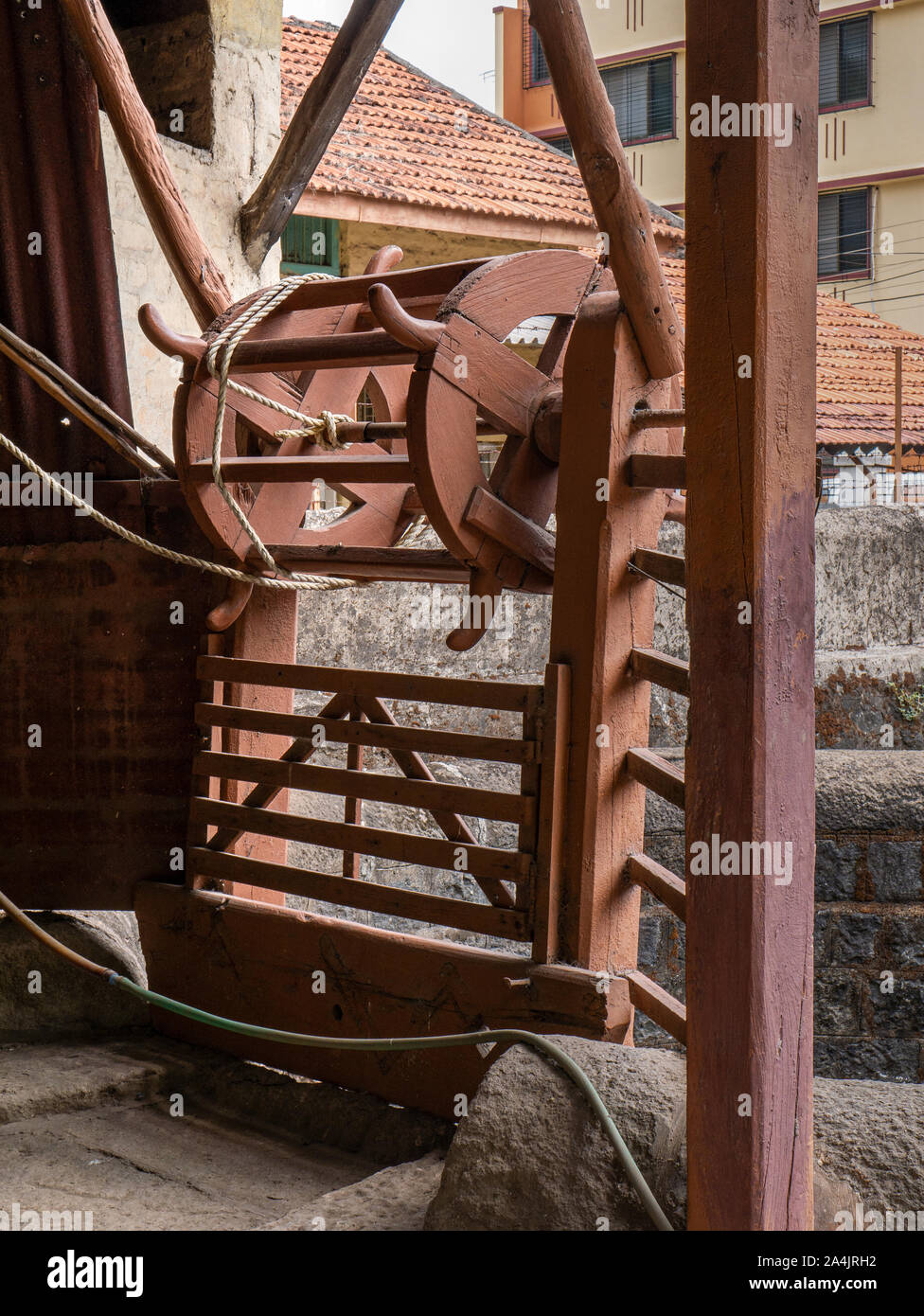 wooden pulley for drawing water from well in courtyard of old house