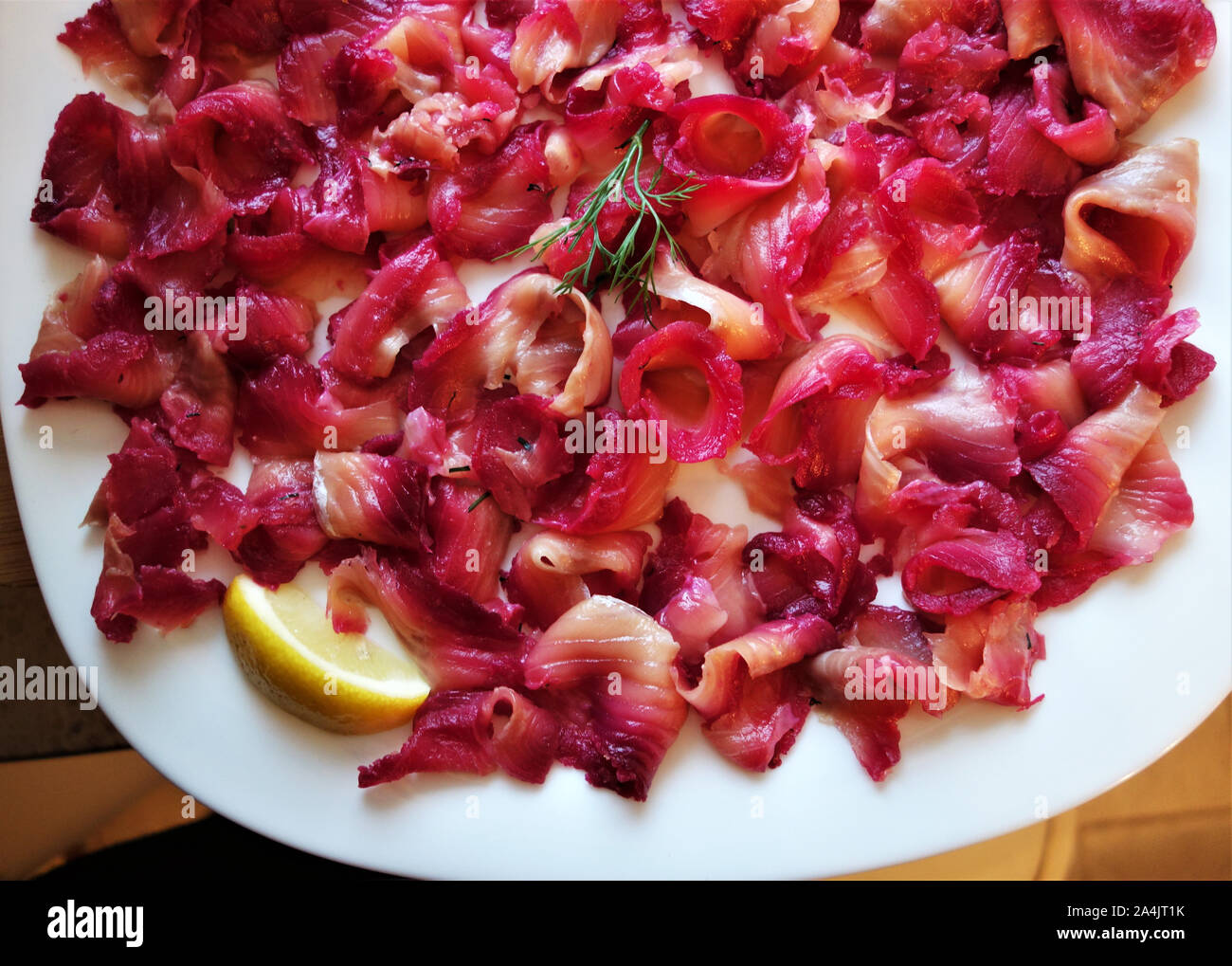 Gravlax scandinavian salmon marinated in salt, sugar and beetroot
