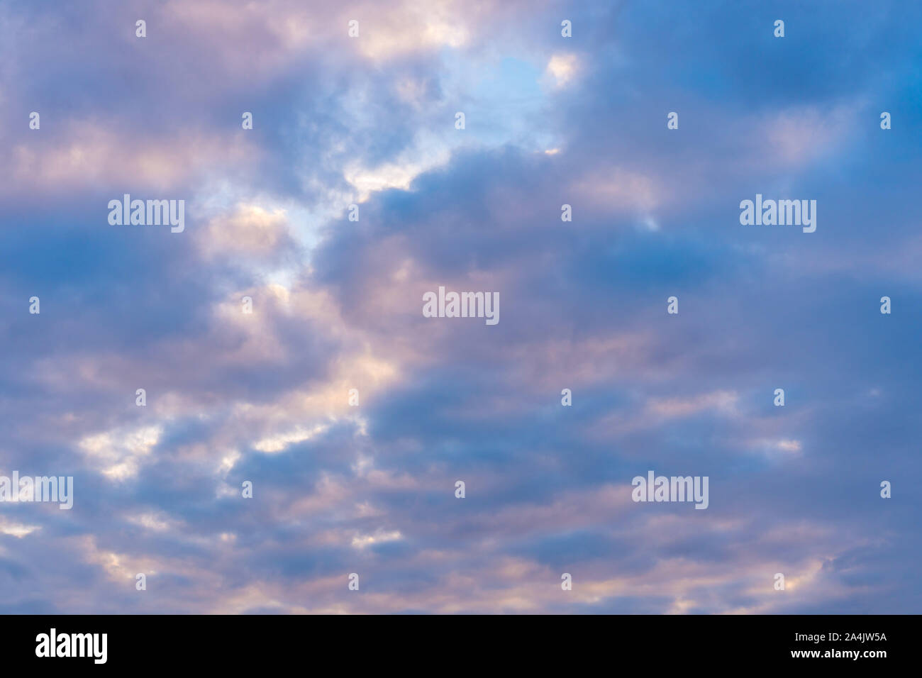Beautiful blue clouds in the sunset sky Stock Photo