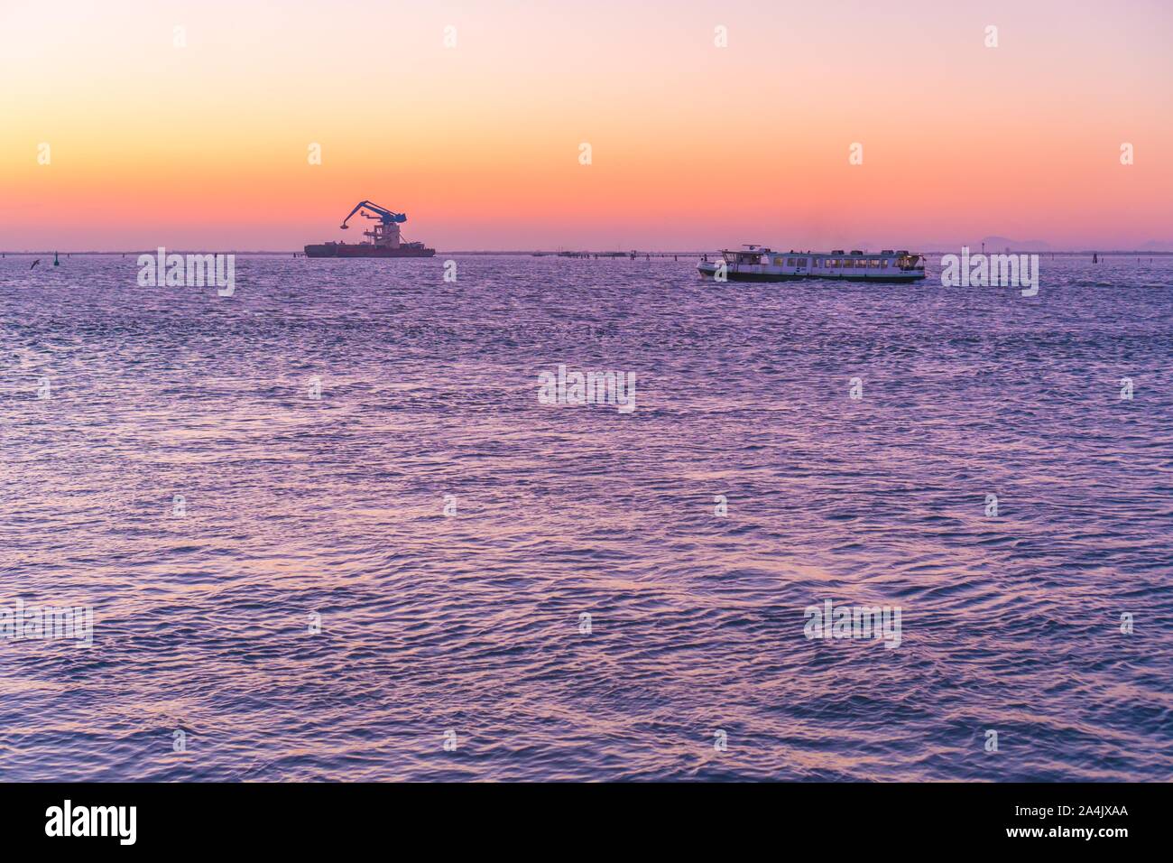 Sunset over the Venice lagoon with a ferry Stock Photo - Alamy