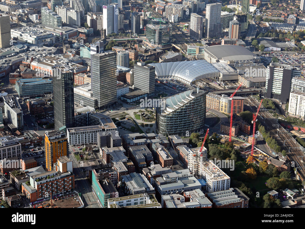 aerial view of Manchester city centre Manchester Victoria Station, Angel Square, CIS Tower, Manchester Arena etc viewing west down Rochdale Rd, UK Stock Photo