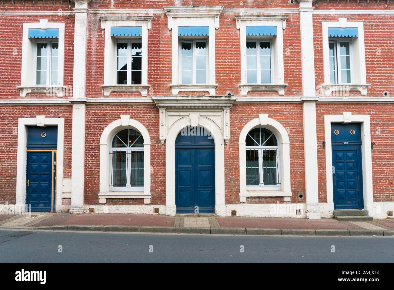 Etretat, Seine-Maritime / France - 14 August 2019: typical Norman stone and brick house front with colorful contrasts Stock Photo