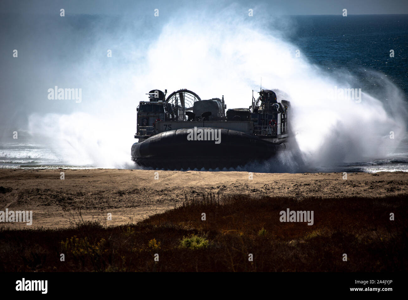 A landing craft, air cushion with Assault Craft Unit 5 embarks onto Red Beach in preparation to offload Marines and heavy equipment with 3rd Battalion, 11th Marine Regiment, 1st Marine Division, on Camp Pendleton, Calif., Oct. 06, 2019. Naval integration is a core component of who we are and how we operate. Working alongside our Navy counterparts provides realistic relevant training necessary for an effective global U.S. Navy and Marine Corps. (U.S. Marines Corps photo by Cpl. Mark A. Lowe II) Stock Photo