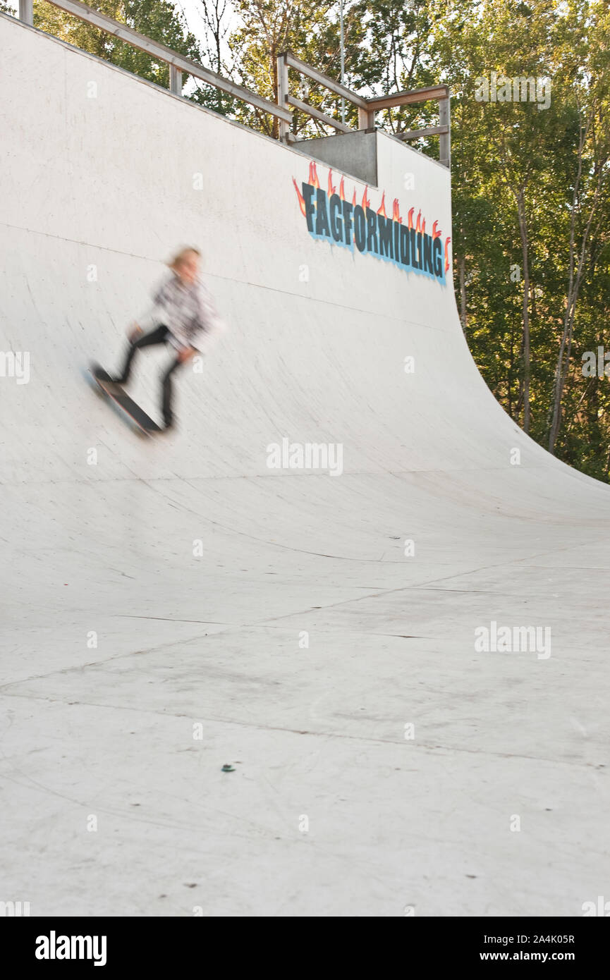 Blurred skateboarder on ramp Stock Photo
