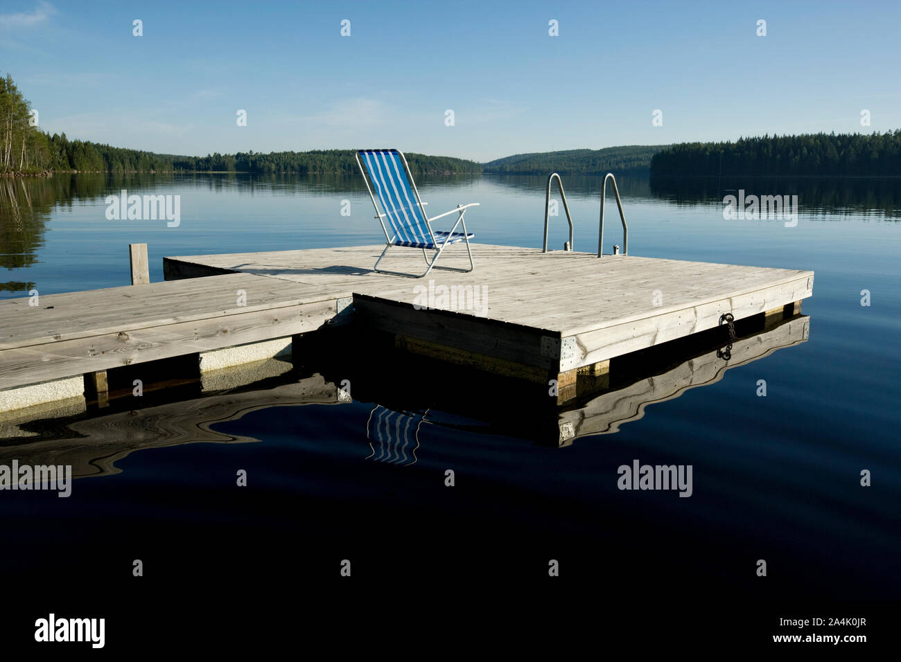 Deckchair on floating pier in Varmland, Sweden Stock Photo