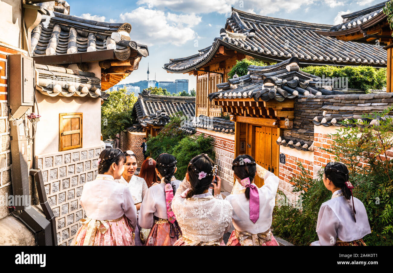 Seoul Korea , 23 September 2019 : Group of Asian tourists girls in traditional Korean Hanbok dressing at Bukchon Hanok village in Seoul South Korea Stock Photo