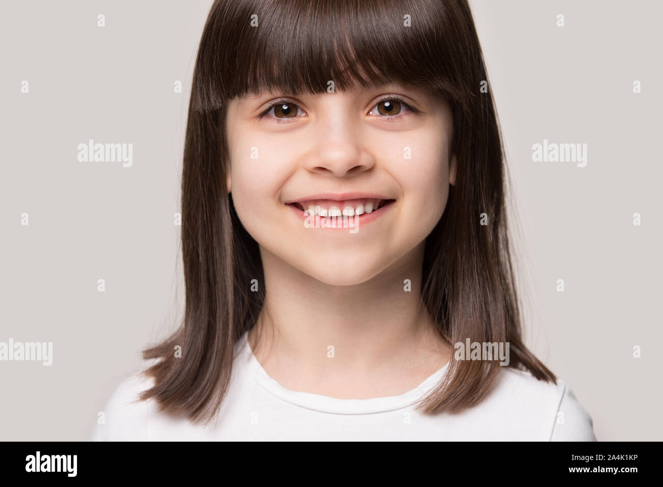 Headshot portrait of smiling little girl posing in studio Stock Photo ...