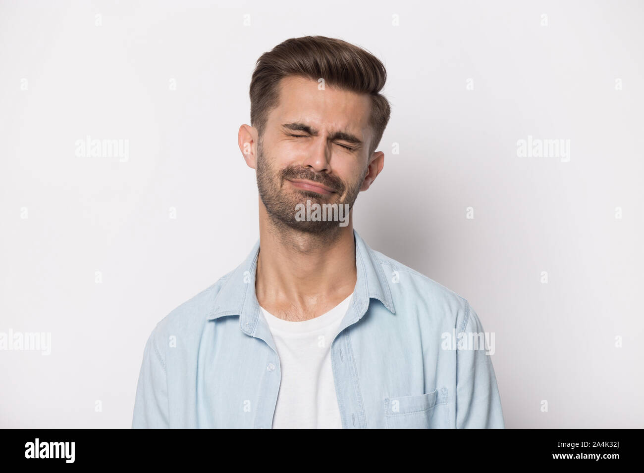 Unhappy young man feel depressed crying whining Stock Photo