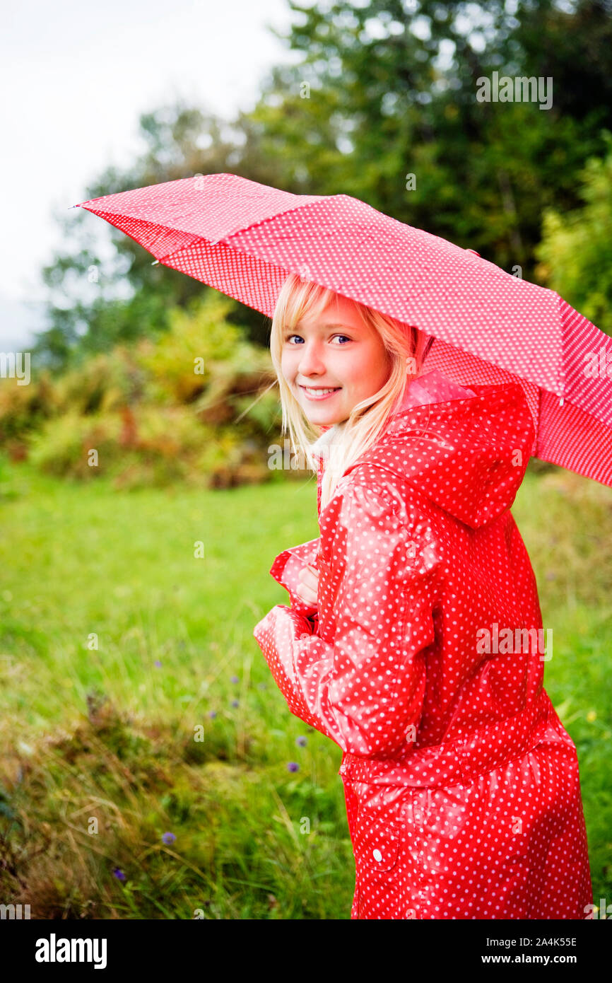 Girl with red umbrella Stock Photo