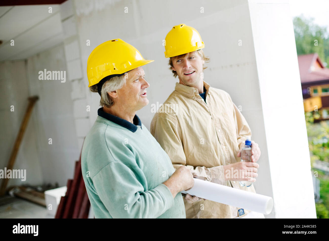 Two men at a Construction site Stock Photo - Alamy