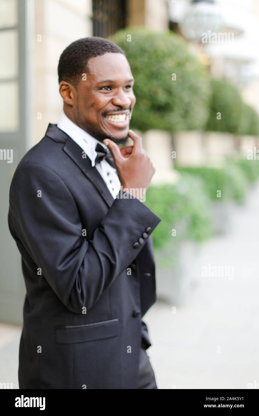 Afro american happy handsome male person wearing suit and smiling Stock ...