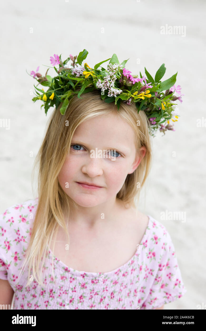 Portrait of Girl Wearing Crown of Wildflowers - wreath Stock Photo