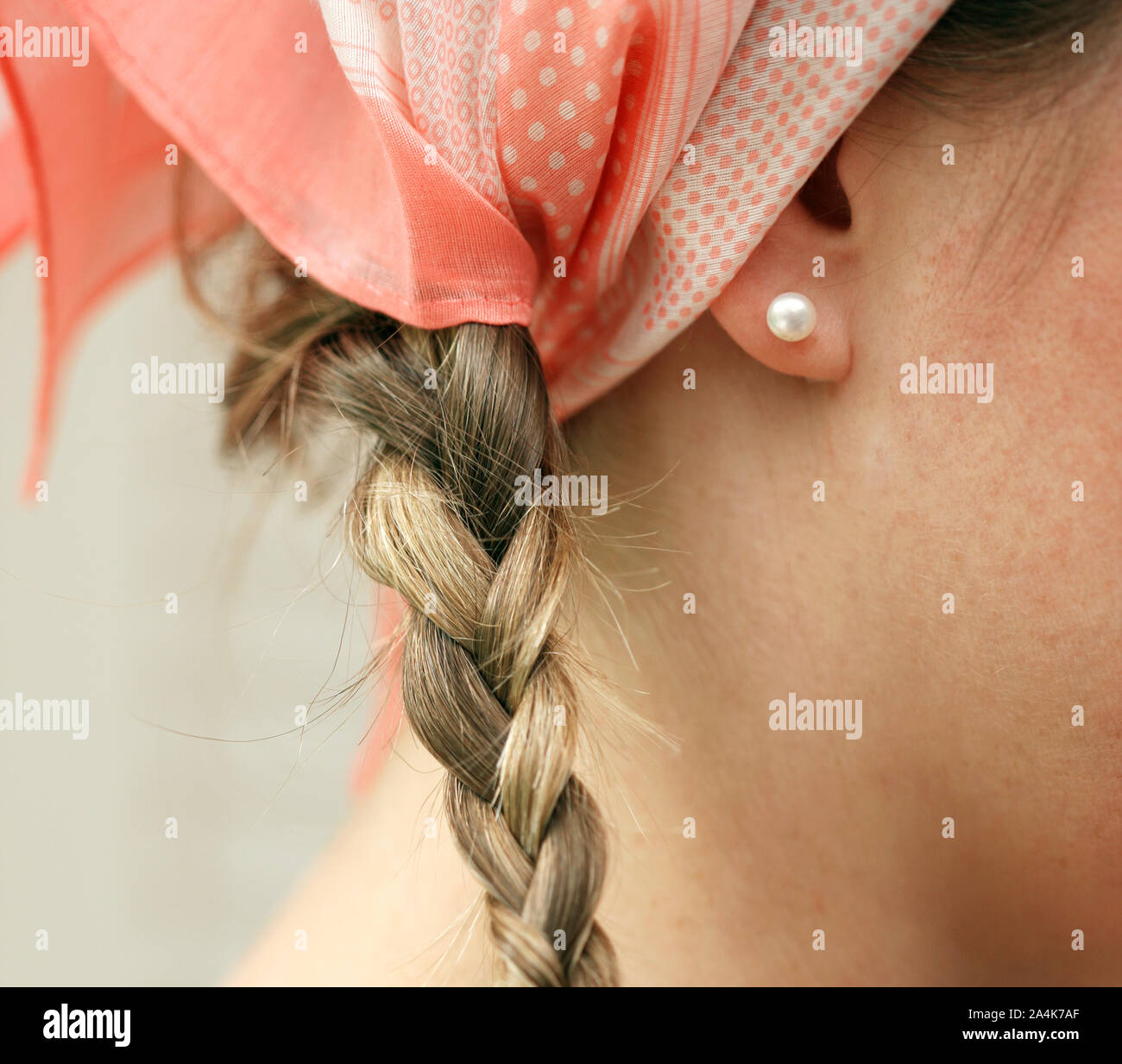 Young woman with scarf and pearl Stock Photo