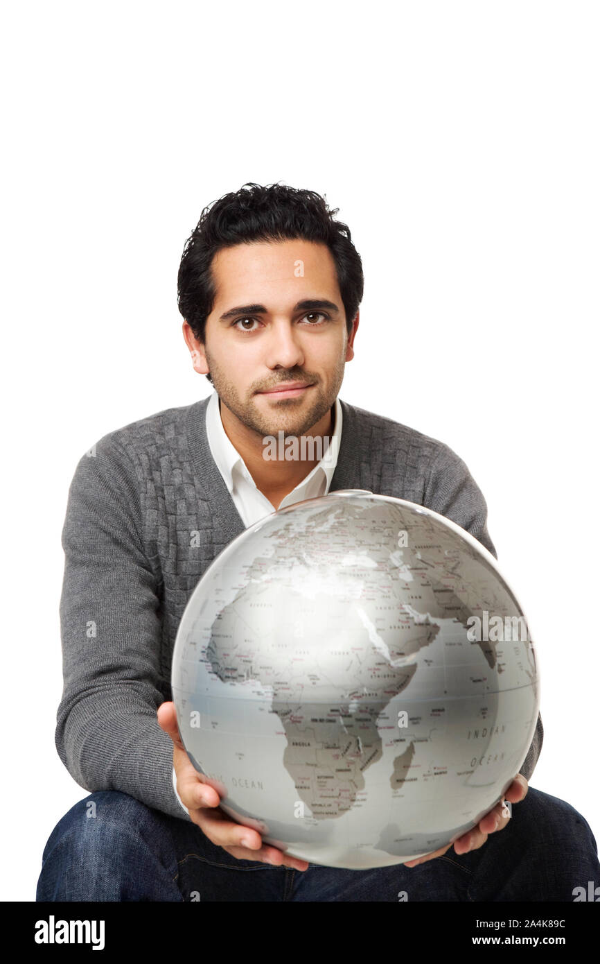 Young man holding globe Stock Photo - Alamy