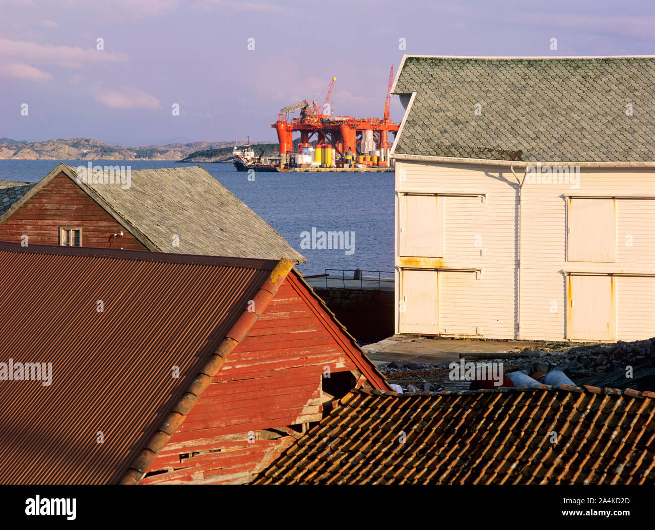 Old houses and oilrigs at Ågotnes, Sotra. Stock Photo