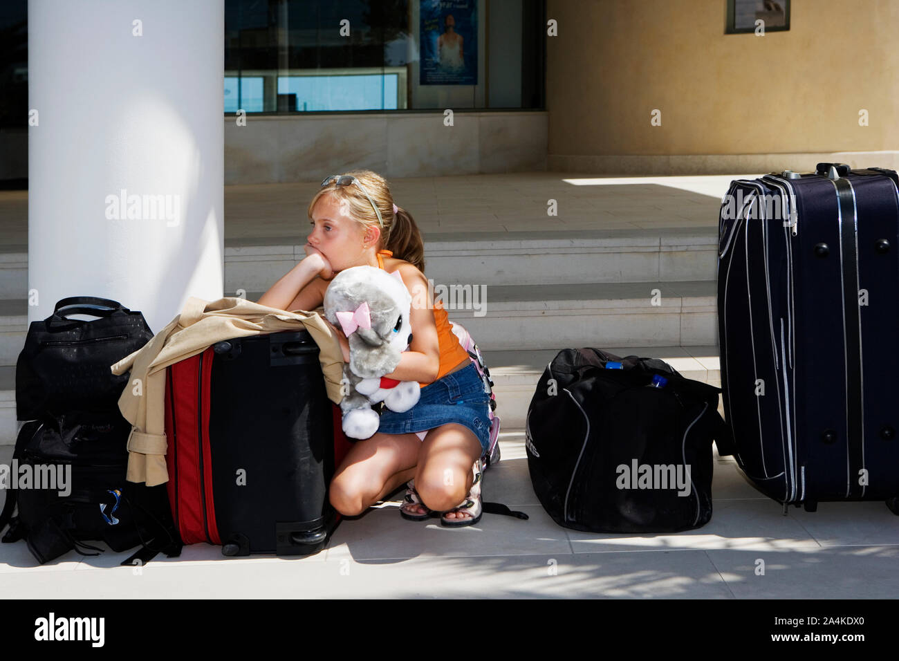 Young girl with luggage Stock Photo Alamy
