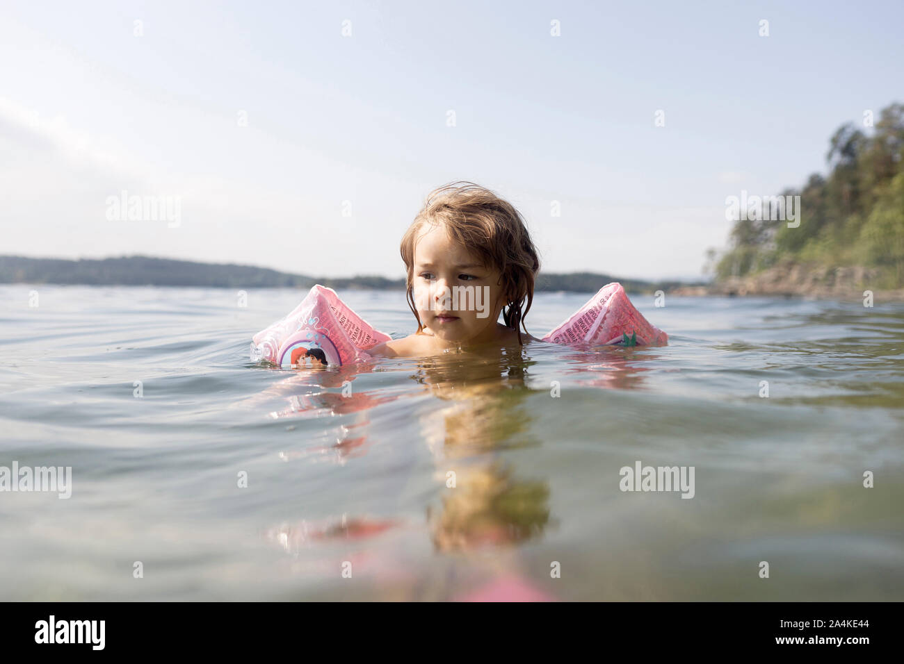 Toddler Girl Swimming With Floaties Stock Photo Alamy