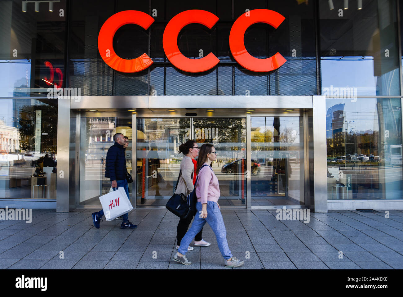 People walk past a Polish clothing store chain CCC. Stock Photo