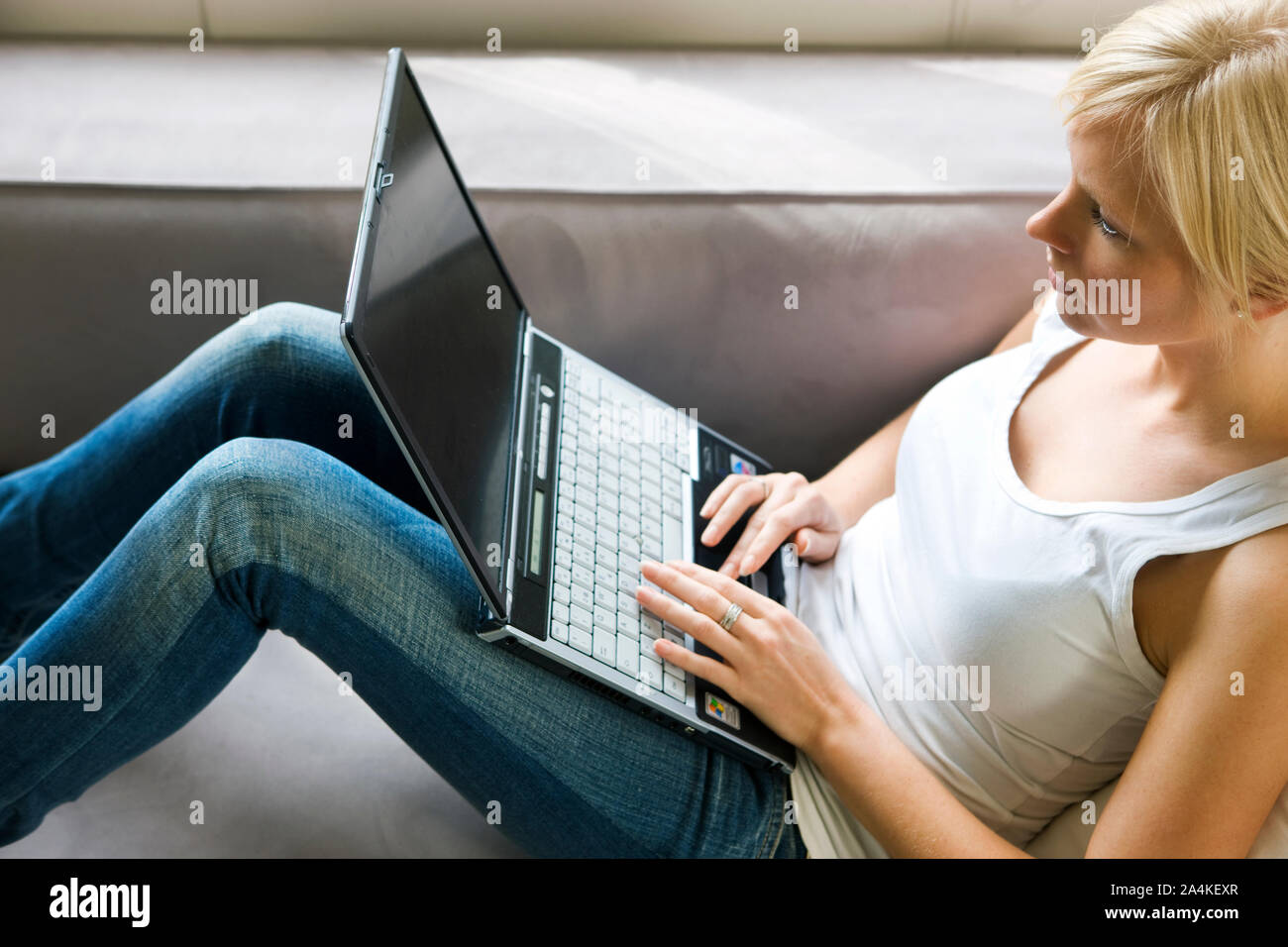 Writing on a laptop - internett dating - chatting Stock Photo