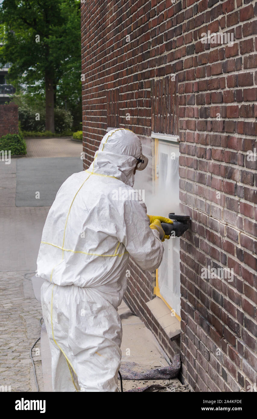 Craftsman flexing on the wall industy Stock Photo