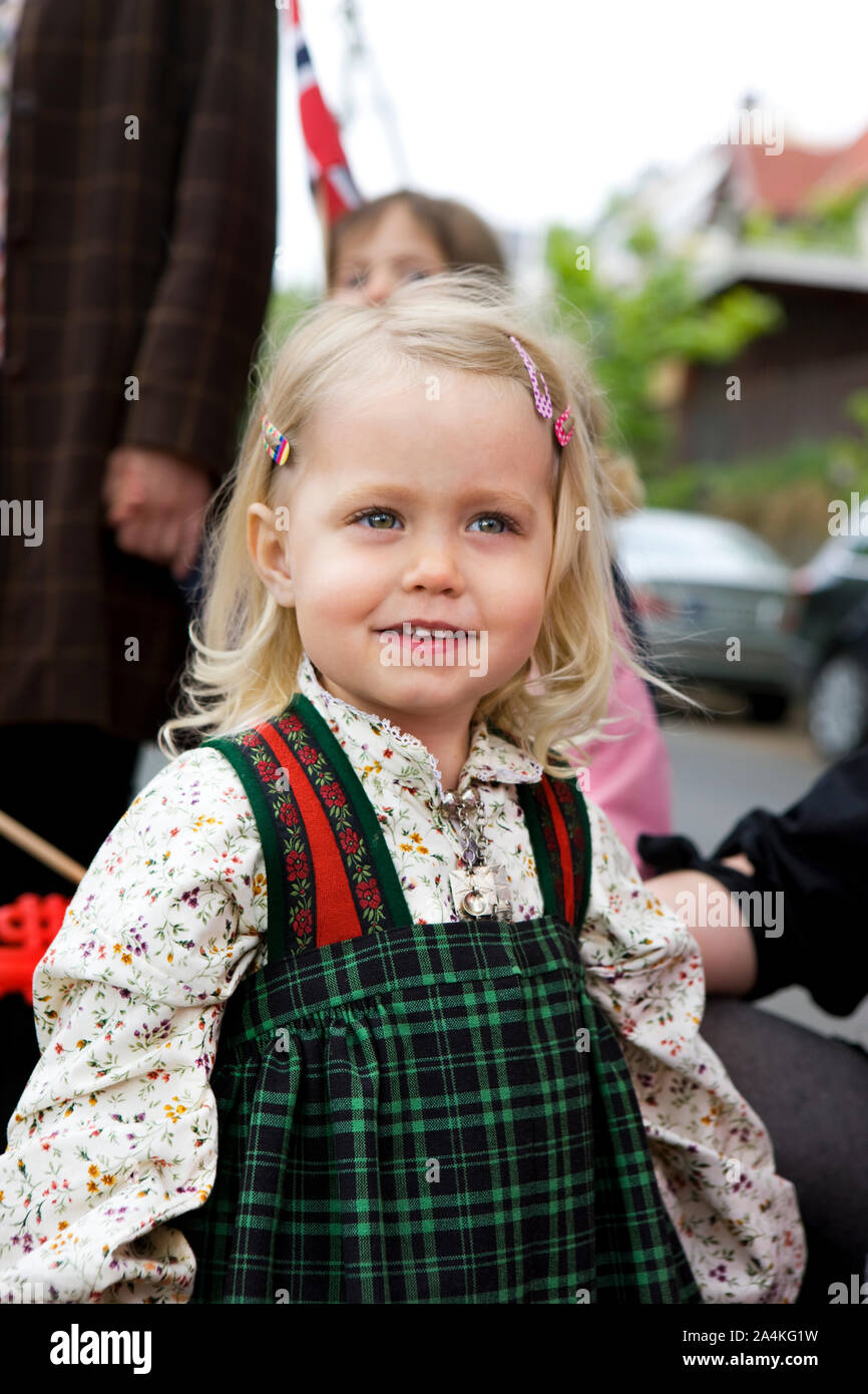 Small Girl Wearing Traditional Costume And Hairclips Celebrating 17th small-girl-wearing-traditional-costume-and-hairclips-celebrating-17th