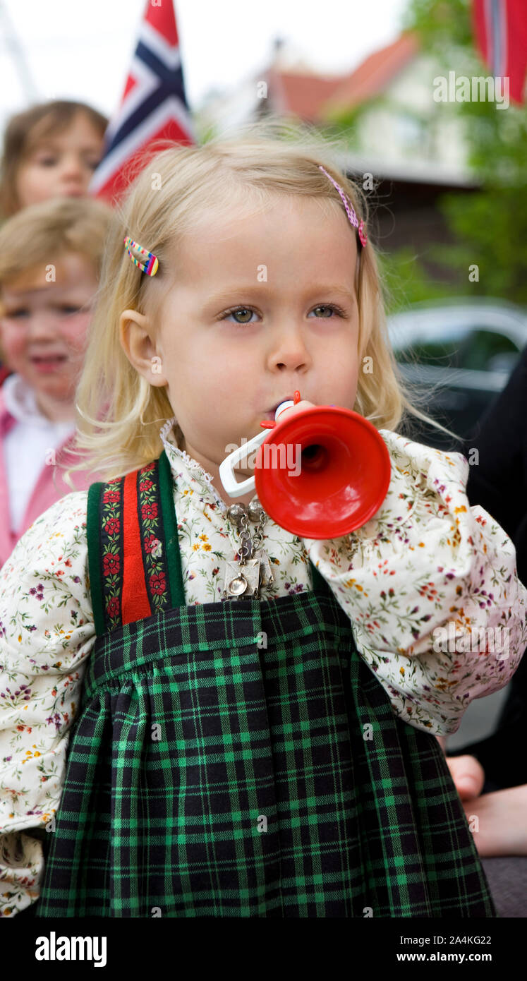 Small Girl Wearing Traditional Costume And Haircclips Playing Toy small-girl-wearing-traditional-costume-and-haircclips-playing-toy