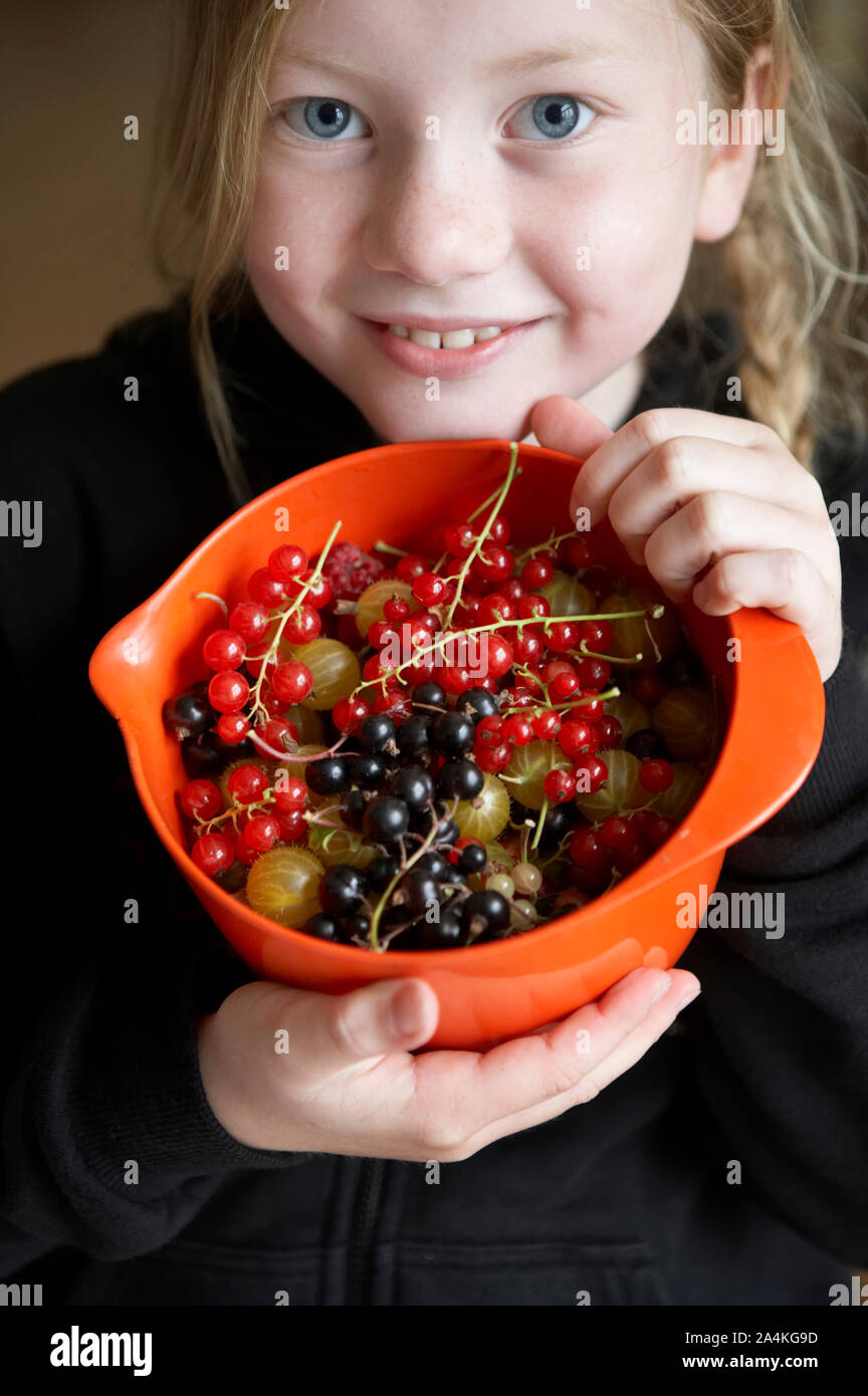 Girl with berries Stock Photo Alamy